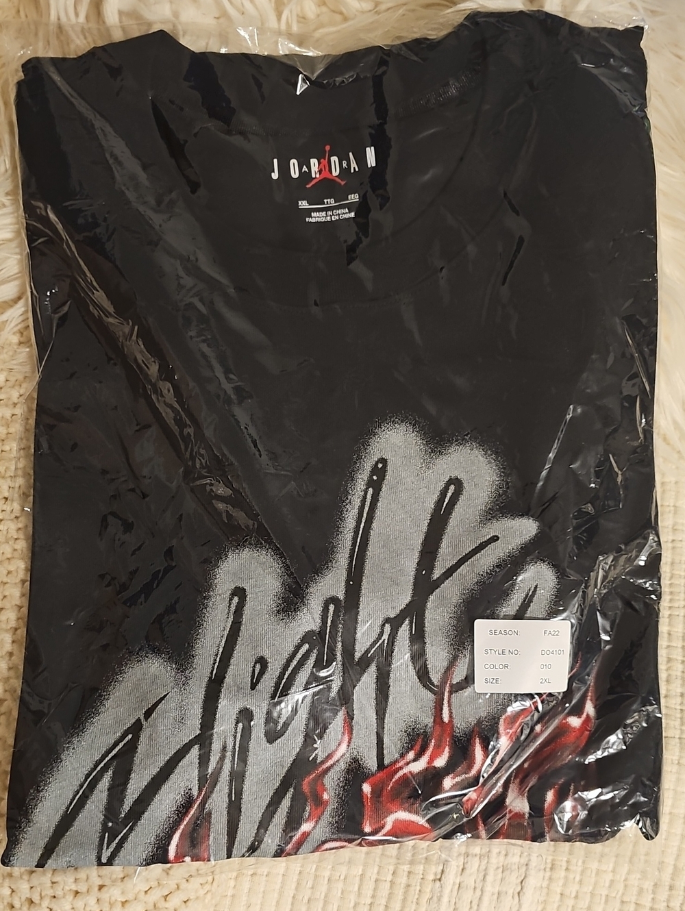 Jordan Black Short Sleeve Tee with White Script and Red Flame Accents